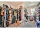 Large walk-in closet with ample storage space, shelving, and plenty of hanging racks at 207 Eagles Flight, Villa Rica, GA 30180