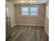 Bright dining area features stainless steel fridge and large windows providing plenty of natural light at 26 Reeves St, Norcross, GA 30071
