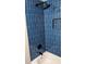 Close up of tiled shower/tub with black hardware and built-in niche at 26 Reeves St, Norcross, GA 30071