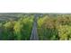 Aerial view of a long paved road surrounded by trees at 231 Laurel Vista Dr, Canton, GA 30114