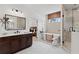 Bathroom featuring a soaking tub, walk-in shower, dual sink vanity and neutral color scheme at 2810 Herrington Dr, Cumming, GA 30041