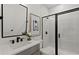 Sleek bathroom featuring marble tiling, modern fixtures, and a glass-enclosed shower at 2810 Herrington Dr, Cumming, GA 30041