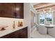 Elegant dining area features custom cabinets, stone countertop, and a unique lighting fixture at 2810 Herrington Dr, Cumming, GA 30041