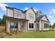 Charming two-story home featuring a welcoming front porch and attractive landscaping at 2810 Herrington Dr, Cumming, GA 30041
