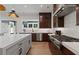 A spacious kitchen with a center island, stainless steel appliances and ample counter space at 2810 Herrington Dr, Cumming, GA 30041