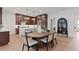 A kitchen and dining area featuring modern decor, a center island, and hardwood floors at 2810 Herrington Dr, Cumming, GA 30041