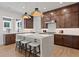 Modern kitchen with center island, stainless steel appliances, and ample cabinet space at 2810 Herrington Dr, Cumming, GA 30041