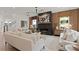 Stylish living room featuring a modern fireplace and wood accent wall at 2810 Herrington Dr, Cumming, GA 30041