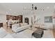 Spacious living room with ample seating, modern lighting, and open floor plan at 2810 Herrington Dr, Cumming, GA 30041