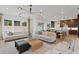 Open concept living room with a modern lighting and seamless flow to the kitchen at 2810 Herrington Dr, Cumming, GA 30041