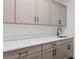 A utility sink with gray cabinets and drawers and a white quartz countertop at 2810 Herrington Dr, Cumming, GA 30041