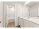 Modern bathroom featuring a bathtub, white cabinets, and a large mirror at 4183 Viola Pl, Atlanta, GA 30349