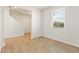 Bright, empty bedroom with hardwood floors and a window, ready for personalization at 4183 Viola Pl, Atlanta, GA 30349