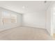 Large bedroom with neutral carpet, lots of light, and an ensuite bathroom at 4183 Viola Pl, Atlanta, GA 30349