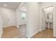 Bright foyer featuring stylish wood-look flooring and a conveniently located powder room at 4183 Viola Pl, Atlanta, GA 30349