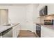 Modern kitchen featuring stainless steel appliances and granite countertops at 4183 Viola Pl, Atlanta, GA 30349