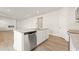 Modern kitchen island featuring stainless steel dishwasher and granite countertops at 4183 Viola Pl, Atlanta, GA 30349