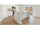 Well-equipped kitchen with white cabinets, granite countertops, and a central island at 4183 Viola Pl, Atlanta, GA 30349