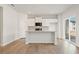 Bright, open-concept kitchen with white cabinetry, granite counters, and a center island at 4183 Viola Pl, Atlanta, GA 30349