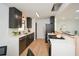 Modern kitchen with dark cabinets, white counters and stainless steel appliances at 689 Concord Sw Rd, Smyrna, GA 30082