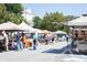 Outdoor farmers market with various vendors selling fresh produce and goods at 1279 Lakeside Overlook, Canton, GA 30114