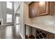 Convenient wet bar in kitchen area with granite countertops and wine storage at 6145 Grindle Rd, Cumming, GA 30041