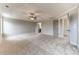 Bright bedroom with plush carpeting, tray ceiling, and plenty of natural light at 6145 Grindle Rd, Cumming, GA 30041