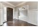 Light filled foyer with hardwood floors and views into the study at 6145 Grindle Rd, Cumming, GA 30041
