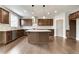 Gourmet kitchen with stainless steel appliances, granite countertops, and a large center island at 6145 Grindle Rd, Cumming, GA 30041