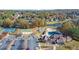 Aerial view showcasing community amenities: pool, tennis courts, playground, and lake, surrounded by trees at 3423 Mulberry Lane Ct, Dacula, GA 30019