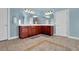 Spacious bathroom with tile floor, double vanity with wood cabinets, and decorative lighting at 3423 Mulberry Lane Ct, Dacula, GA 30019