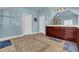 Spacious bathroom with tile floor, double vanity with wood cabinets, and decorative lighting at 3423 Mulberry Lane Ct, Dacula, GA 30019