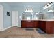 Spacious bathroom with tile floor, double vanity with wood cabinets, and decorative lighting at 3423 Mulberry Lane Ct, Dacula, GA 30019