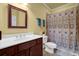 Bathroom featuring a single sink vanity and shower with a patterned shower curtain at 3423 Mulberry Lane Ct, Dacula, GA 30019