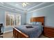 Bright bedroom featuring wood floors, plantation shutters, and neutral paint at 3423 Mulberry Lane Ct, Dacula, GA 30019