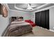 Bedroom features a bed, sofa, and decorative headboard with curtains at 3423 Mulberry Lane Ct, Dacula, GA 30019