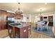 Open-concept kitchen and dining area with stainless steel appliances and a center island at 3423 Mulberry Lane Ct, Dacula, GA 30019