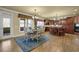 Spacious kitchen with wooden cabinets, a center island, and an adjacent dining area for Gathering gatherings at 3423 Mulberry Lane Ct, Dacula, GA 30019