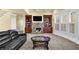 Cozy living room with a stone fireplace, built-in shelving, and plenty of natural light at 3423 Mulberry Lane Ct, Dacula, GA 30019
