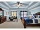 Luxurious main bedroom featuring a trey ceiling, sitting area, and plush carpeting at 3423 Mulberry Lane Ct, Dacula, GA 30019