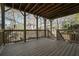 Upper deck with exposed rafters, wood railing, and great outdoor views at 3423 Mulberry Lane Ct, Dacula, GA 30019