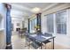 Bright dining area showcases decorative columns, a mirrored wall, and an elegant pendant light at 240 Renaissance Pkwy # 116, Atlanta, GA 30308