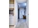 Hallway view highlighting the transition between the kitchen, dining area, and living spaces at 240 Renaissance Pkwy # 116, Atlanta, GA 30308