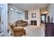 Cozy living room with fireplace, bar area, comfortable seating, and a bright, airy ambiance at 240 Renaissance Pkwy # 116, Atlanta, GA 30308