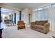 Bright, open-concept living room with comfortable seating and an adjacent dining area at 240 Renaissance Pkwy # 116, Atlanta, GA 30308
