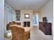 Spacious living room features a fireplace, bar area, comfortable seating, and neutral decor at 240 Renaissance Pkwy # 116, Atlanta, GA 30308