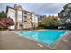 A community pool at a condo complex offers a great way to cool off and socialize at 240 Renaissance Pkwy # 116, Atlanta, GA 30308