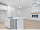 Kitchen island with white cabinets, quartz countertop and stainless steel dishwasher at 1068 Rose Dr, Marietta, GA 30060