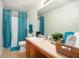 Bright bathroom featuring coordinated towels and a vanity with storage at 6476 Snowden Dr, Atlanta, GA 30349