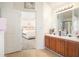 Ensuite bathroom with dual sinks and views into the main bedroom at 6476 Snowden Dr, Atlanta, GA 30349